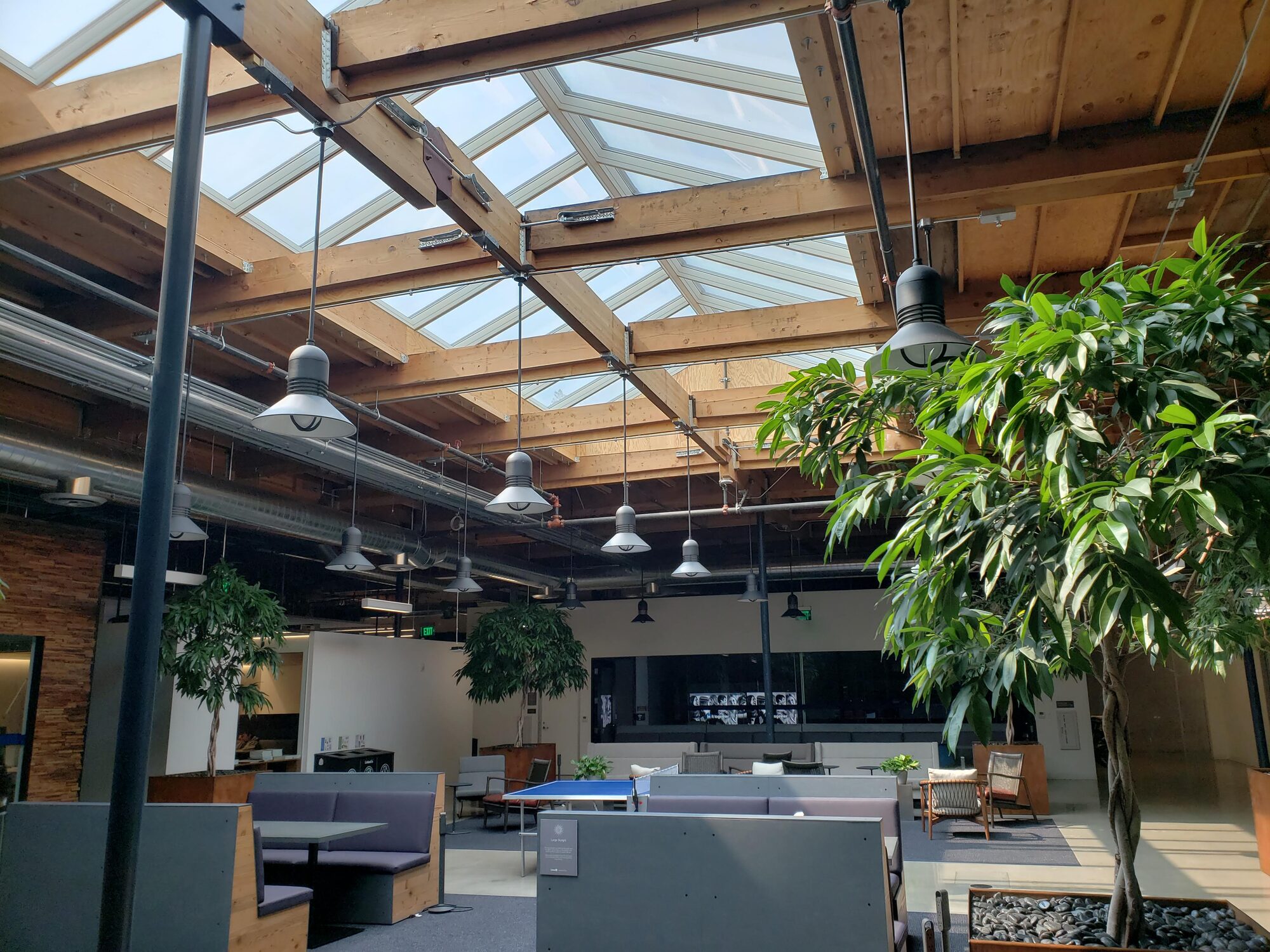 Daylit atrium with operable skylights and exposed mass timber structure