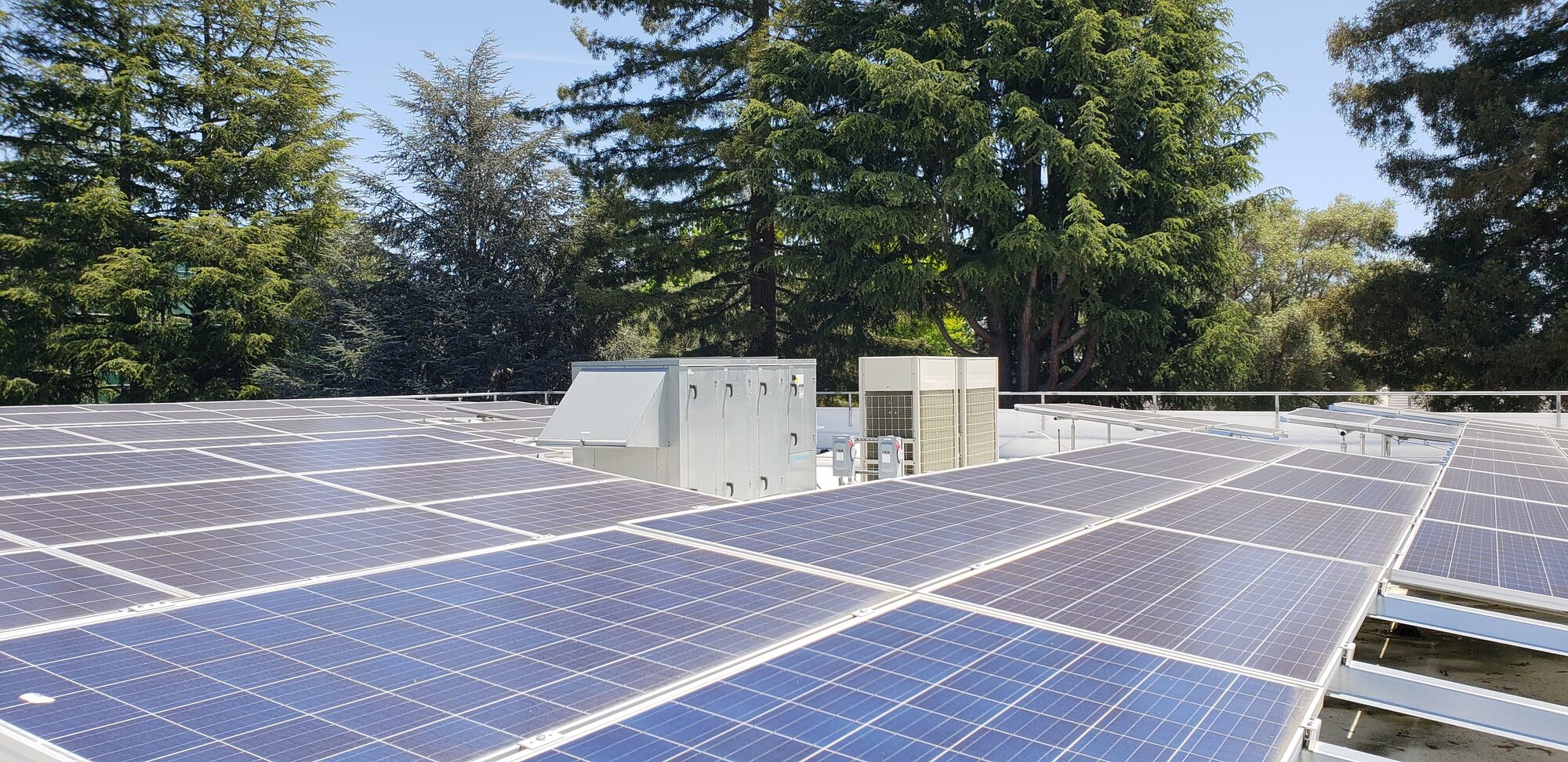 Rooftop solar PV array with dedicated outdoor air system and heat pump equipment